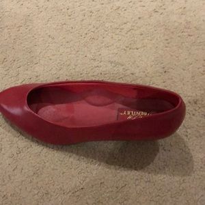 Red patent leather pumps